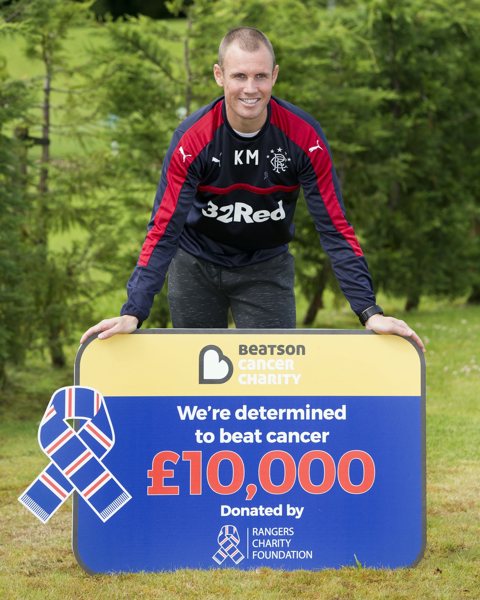 Rangers striker Kenny Miller hands over £10k pounds to the Beatson Cancer Charity from The Rangers Charity Foundation.