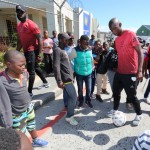 Mark Mayambela with children in Khayelitsha during the Ajax Cape Town CSI in Khayelitsha, Cape Town on 30 September 2016 ©Chris Ricco/BackpagePix